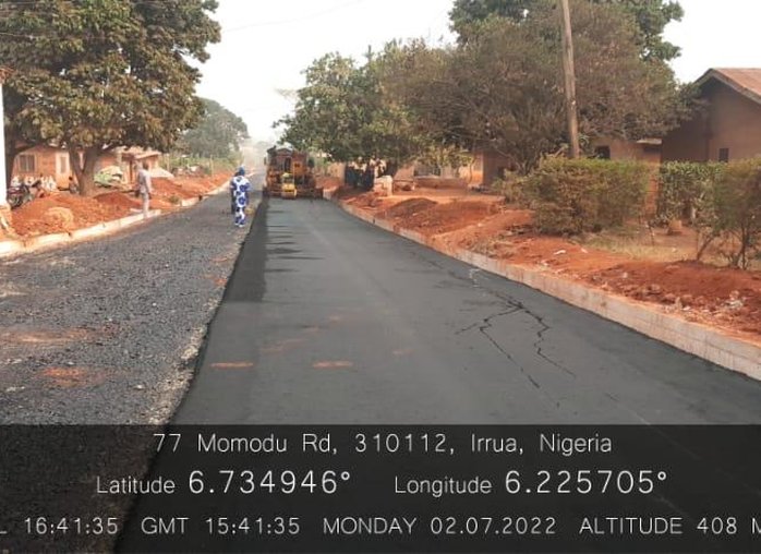 Asphalt paving under way on Momodu Road, Irrua township roads rehabilitation, Edo Central